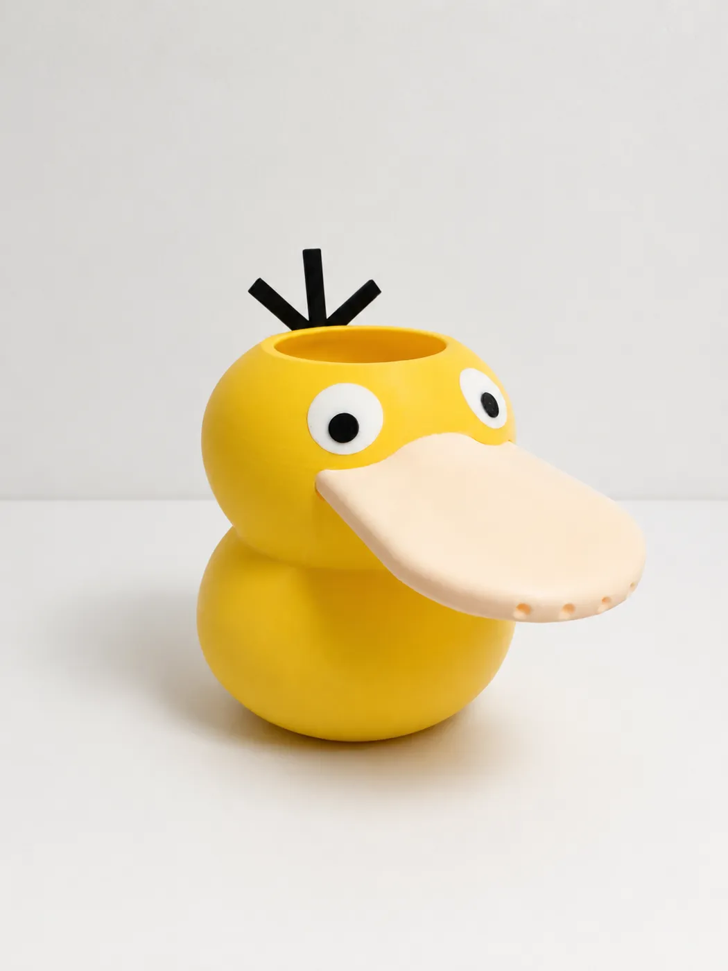 Regadera con forma de Psyduck de Pokémon impresa en 3D