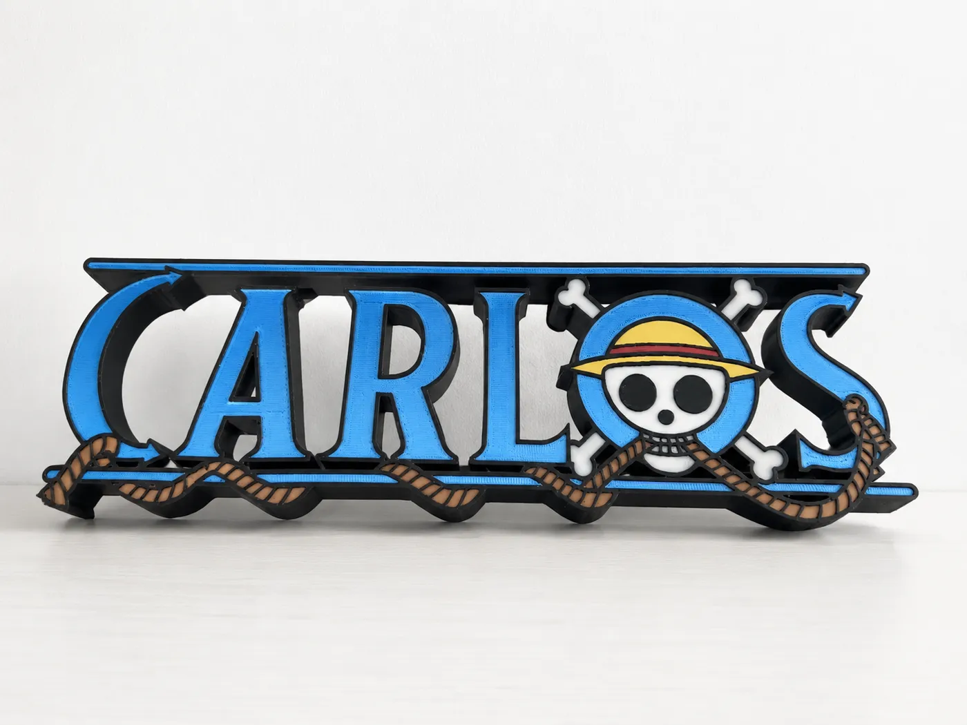 Cartel personalizado con el nombre Carlos impreso en 3D